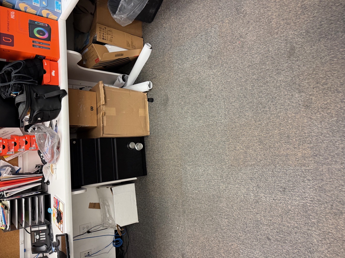 Clean organized office space with desk and equipment